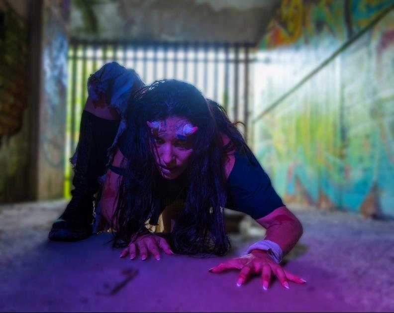 Fantasy creature under purple light